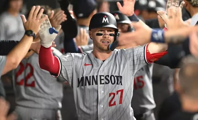 Minnesota Twins' Ryan Jeffers (27) celebrates with teammates in the dugout after hitting a three-run home run during the fifth inning of a baseball game against the Chicago White Sox Saturday, Sept. 5, 2026, in Chicago. (AP Photo/Paul Beaty)