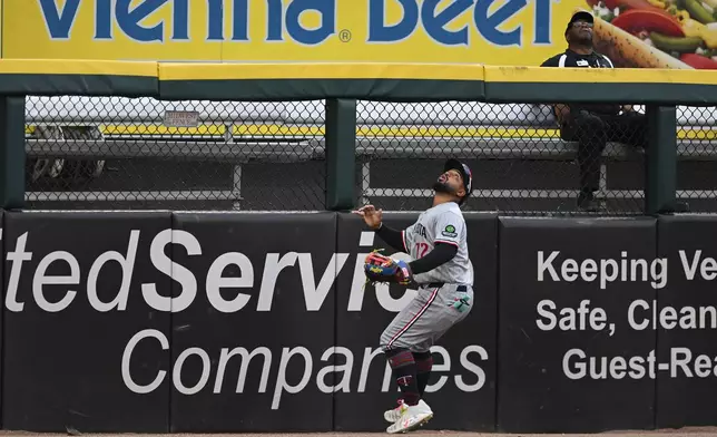 Minnesota Twins left fielder Gabby Gonzalez watches a two-run home run hit by Chicago White Sox's Munetaka Murakami, of Japan, during the first inning of a baseball game Saturday, Sept. 5, 2026, in Chicago. (AP Photo/Paul Beaty)