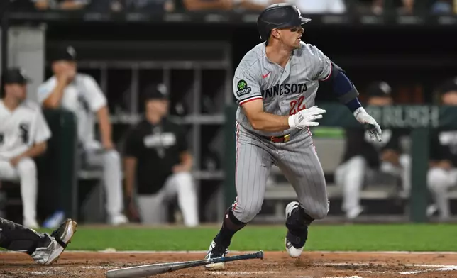 Minnesota Twins' Brooks Lee watches his RBI double during the fourth inning of a baseball game against the Chicago White Sox, Saturday, Sept. 5, 2026, in Chicago. (AP Photo/Paul Beaty)