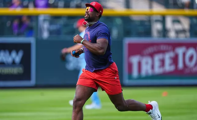 St. Louis Cardinals right fielder Jordan Walker warms up before a baseball game against the Colorado Rockies, Saturday, Sept. 5, 2026, in Denver. (AP Photo/David Zalubowski)