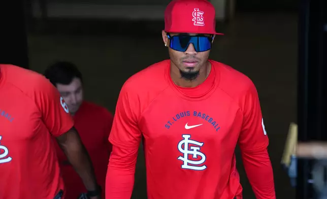 St. Louis Cardinals relief pitcher Hancel Rincon emerges from the clubhouse to take part in practice before a baseball game against the Colorado Rockies, Saturday, Sept. 5, 2026, in Denver. (AP Photo/David Zalubowski)