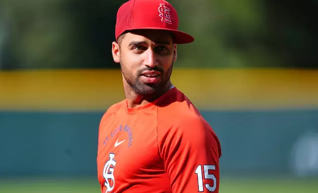 St. Louis Cardinals left fielder José Fermín warms up before a baseball game against the Colorado Rockies, Saturday, Sept. 5, 2026, in Denver. (AP Photo/David Zalubowski)