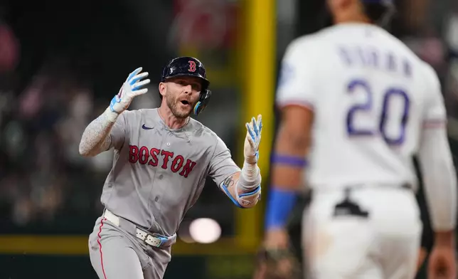 Boston Red Sox's Trevor Story celebrates his three-run home run as he jogs past Texas Rangers' Ezequiel Duran (20) in the eighth inning of a baseball game Thursday, Sept. 17, 2026, in Arlington, Texas (AP Photo/Tony Gutierrez)