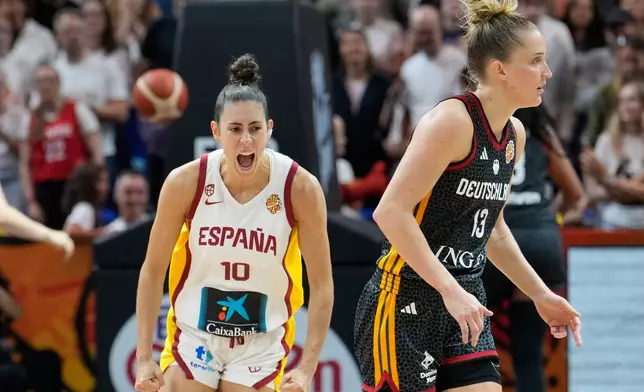 Spain's Maite Cazorla and Iyana Martín hug during the Women's Basketball World Cup the third-place match between the Germany and Spain in Berlin, Sunday, Sept. 13, 2026. (AP Photo/Ebrahim Noroozi)