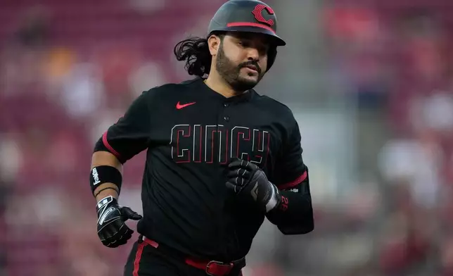 Cincinnati Reds' Eugenio Suárez rounds the bases after hitting a three-run homer in the third inning of a baseball game against the Milwaukee Brewers, Friday, Sept. 4, 2026, in Cincinnati. (AP Photo/Carolyn Kaster)