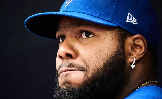 Toronto Blue Jays' Vladimir Guerrero Jr. looks out of the dugout before of a baseball game against the Baltimore Orioles in Toronto, Saturday, Sept. 12, 2026. (Sammy Kogan/The Canadian Press via AP)