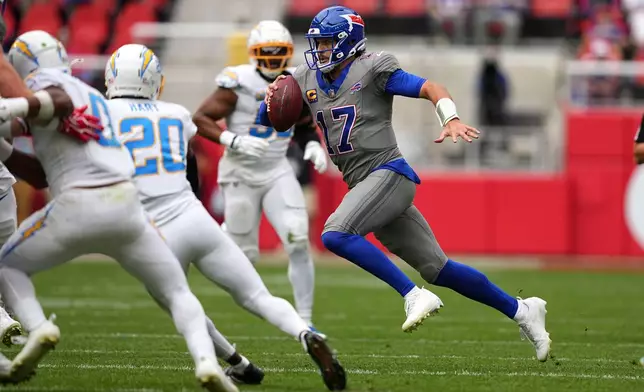 Buffalo Bills quarterback Josh Allen (17) runs up field during the second half of an NFL football game against the Los Angeles Chargers, Sunday, Sept. 27, 2026, in Orchard Park, N.Y. (AP Photo/Matt Rourke)