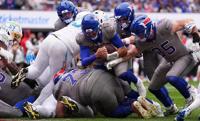 Buffalo Bills quarterback Josh Allen (17) scores on a touchdown run during the second half of an NFL football game against the Los Angeles Chargers, Sunday, Sept. 27, 2026, in Orchard Park, N.Y. (AP Photo/Matt Rourke)