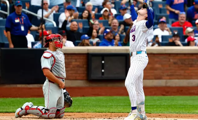 New York Mets' Carson Benge, right, reacts after hitting a home run against the Philadelphia Phillies during the second inning of a baseball game, Saturday, Sept. 19, 2026, in New York. (AP Photo/Noah K. Murray)
