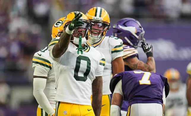 Green Bay Packers wide receiver Matthew Golden (0) celebrates after catching a pass for a first down during the second half of an NFL football game against the Minnesota Vikings, Sunday, Sept. 13, 2026, in Minneapolis, Minn. (AP Photo/Abbie Parr)