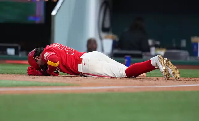 Texas Rangers' Nicky Lopez reacts after being hit by a pitch from Toronto Blue Jays starting pitcher José Soriano during the second inning of a baseball game Saturday, Sept. 19, 2026, in Arlington, Texas. (AP Photo/Julio Cortez)