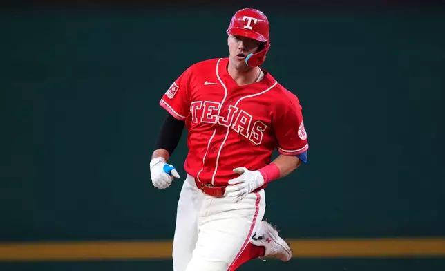 Texas Rangers' Josh Jung runs the bases after hitting a solo home run off Toronto Blue Jays starting pitcher JosÈ Soriano during the first inning of a baseball game Saturday, Sept. 19, 2026, in Arlington, Texas. (AP Photo/Julio Cortez)