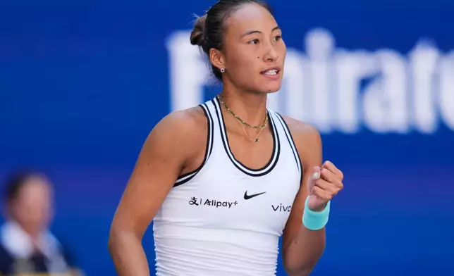 Qinwen Zheng, of China, reacts during a match against Iga Swiatek, of Poland, during the fourth round of the U.S. Open tennis championships, Monday, Sept. 7, 2026, in New York. (AP Photo/Seth Wenig)