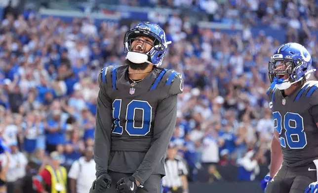 Indianapolis Colts wide receiver Keenan Allen (10) celebrates after a touchdown catch against the Houston Texans during the first half of an NFL football game, Sunday, Sept. 27, 2026, in Indianapolis. (AP Photo/Jeff Roberson)