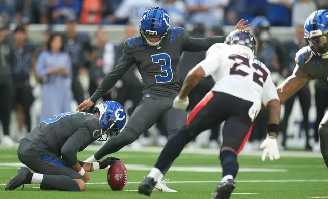 Indianapolis Colts kicker Spencer Shrader (3) kicks a game-winning field against the Indianapolis Colts during the second half of an NFL football game, Sunday, Sept. 27, 2026, in Indianapolis. (AP Photo/Jeff Roberson)