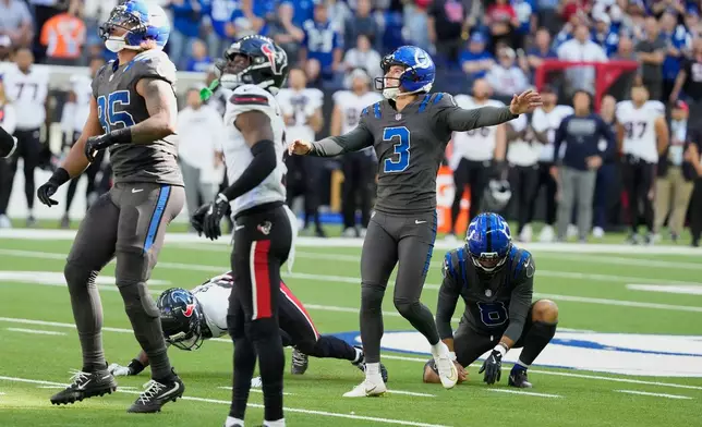 Indianapolis Colts kicker Spencer Shrader (3) watches his game-winning field goal against the Houston Texans during the second half of an NFL football game, Sunday, Sept. 27, 2026, in Indianapolis. (AP Photo/Michael Conroy)