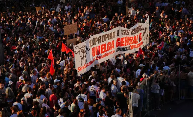 People gather during a protest following the eviction last Wednesday of 87-year-old Maricarmen to demand stronger laws to protect renters at Puerta del Sol in Madrid, Spain, Saturday, Sept. 26, 2026. (AP Photo/Manu Fernandez)