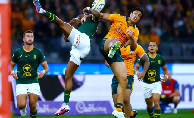 South Africa's Aphelele Fassi, left, and Australia's Joseph-Aukuso Suaalii compete for a high ball during their rugby union test match in Perth, Australia, on Sunday, Sept. 27, 2026. (AP Photo/Gary Day)