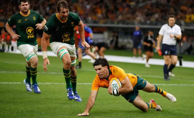 Australia's Ben Donaldson, right scores a try against South Africa during their rugby union test match in Perth, Australia, on Sunday, Sept. 27, 2026. (AP Photo/Gary Day)