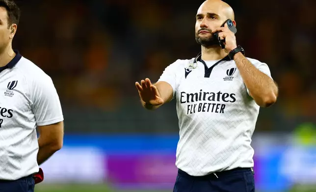 Andrea Piardi uses a cellular phone to communicate with off-field officials during the rugby union test match between Australia and South Africa in Perth, Australia, on Sunday, Sept. 27, 2026. (AP Photo/Gary Day)