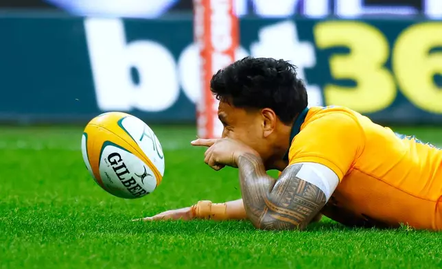 Australia's Len Ikitau celebrates scoring a try against South Africa during their rugby union test match in Perth, Australia, on Sunday, Sept. 27, 2026. (AP Photo/Gary Day)