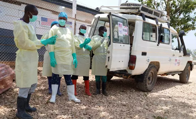 Health workers who are members of the safe and dignified burial team prepare to bury Abineno Justine, a 38 year old woman who died of the Ebola virus, in Bunia, Congo, Friday, Sept. 4, 2026. (AP Photo/Dieudonne Dirole)
