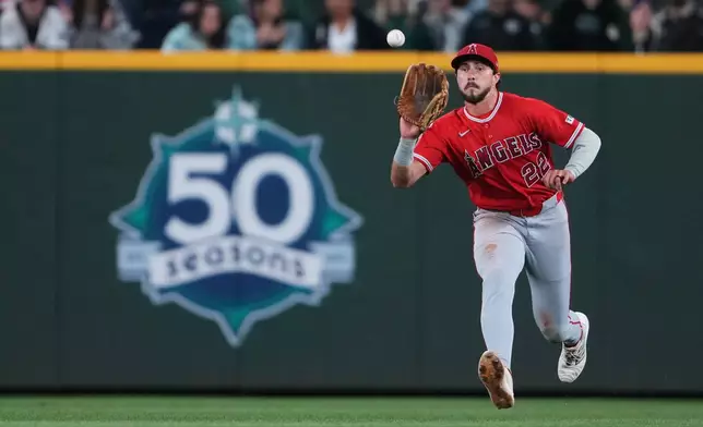 Los Angeles Angels center fielder Bryce Teodosio catches a fly ball off the bat of Seattle Mariners' Josh Naylor for an out during the eighth inning of a baseball game, Thursday, Sept. 24, 2026, in Seattle. (AP Photo/Lindsey Wasson)
