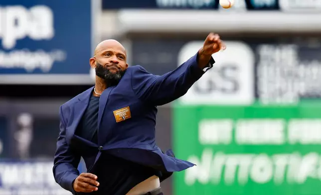 Hall of Famer CC Sabathia throws out the ceremonial first pitch before in the first baseball game of a doubleheader between the New York Yankees and Baltimore Orioles, Friday, Sept. 25, 2026, in New York. (AP Photo/Noah K. Murray)