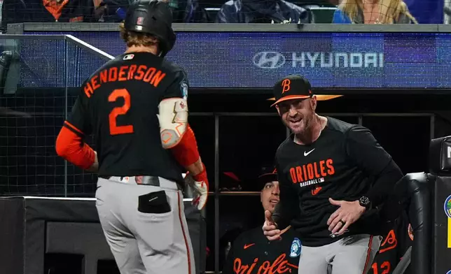 Baltimore Orioles manager Craig Albernaz greets Gunnar Henderson (2) after Henderson hit a home run during the eighth inning of a baseball game against the New York Mets Monday, Sept. 14, 2026, in New York. (AP Photo/Frank Franklin II)