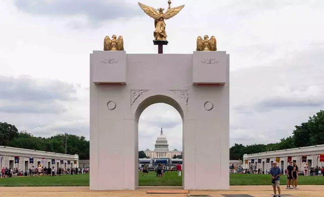 FILE - A mockup of President Donald Trump's proposed triumphal arch stands at the Great American State Fair on the National Mall, June 27, 2026, in Washington. (AP Photo/Jen Golbeck, File)