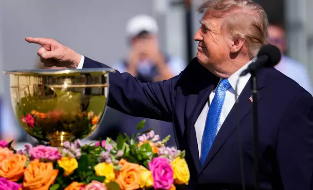 USA teams' International teams' during a Presidents Cup golf tournament final round singles match at Medinah Country Club, Sunday, Sept. 27, 2026, in Medinah, Ill. (AP Photo/Matt Slocum)