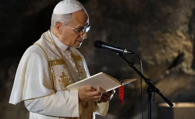 In this handout photo provided by Vatican Media Pope Leo XIV leads a prayer at the Grotto of the Apparitions of Massabielle, in Lourdes, France, Saturday, Sept. 26, 2026. (Vatican Media via AP)