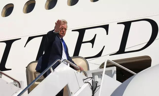 President Donald Trump boards Air Force One after an emergency inflatable slide deployed before he arrived at Joint Base Andrews, Md., Wednesday, Sept. 9, 2026. (AP Photo/Jacquelyn Martin)