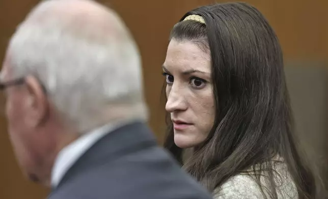 Lindsay Clancy looks to her lawyer Kevin Reddington as the jury keeps deliberating at her murder trial at Plymouth Superior Court in Plymouth, Mass., Tuesday, Sept. 1, 2026. (Greg Derr/The Patriot Ledger via AP, Pool)