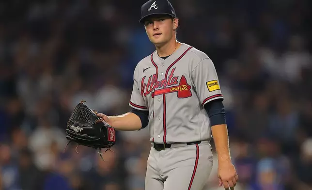 Atlanta Braves' JR Ritchie walks back to the dugout after being taken out during the fifth inning of a baseball game against the Chicago Cubs, Wednesday, Sept. 16, 2026, in Chicago. (AP Photo/Melissa Tamez)