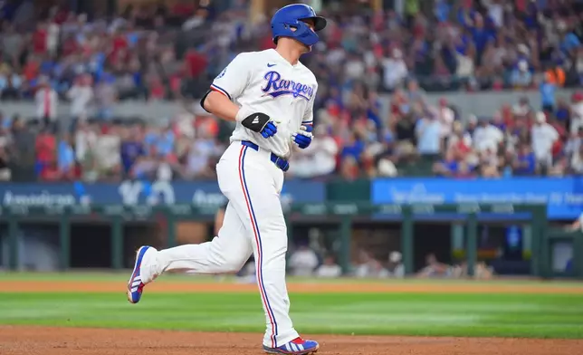 Texas Rangers' Corey Seager runs the bases after hitting a solo home run against the New York Mets during the sixth inning of a baseball game Thursday, Sept. 24, 2026, in Arlington, Texas. (AP Photo/Julio Cortez)