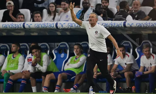 PSG's head coach Luis Enrique gestures during the French League One soccer match between Marseille and Paris Saint-Germain in Marseille, France, Sunday, Sept. 20, 2026. (AP Photo/Philippe Magoni)