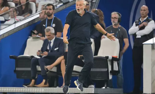 Marseille's head coach Bruno Genesio reacts during the French League One soccer match between Marseille and Paris Saint-Germain in Marseille, France, Sunday, Sept. 20, 2026. (AP Photo/Philippe Magoni)