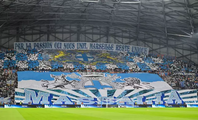 Marseille fans cheer for their team prior to the French League One soccer match between Marseille and Paris Saint-Germain in Marseille, France, Sunday, Sept. 20, 2026. (AP Photo/Philippe Magoni)