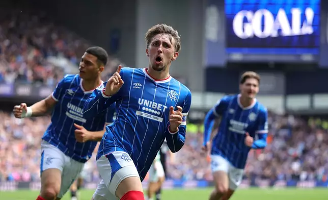 Rangers' Daniel Neil celebrates scoring their side's first goal during the Scottish League Cup soccer match between Rangers and Celtic, in Glasgow, Sunday Sept. 13, 2026. (Steve Welsh/PA via AP)