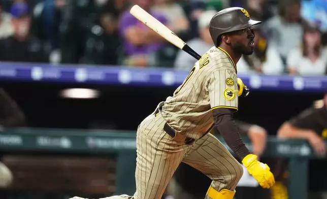 San Diego Padres' Samad Taylor breaks from the batter's box after connecting for a single to drive in two runs off Colorado Rockies relief pitcher Nick Frasso in the fifth inning of a baseball game Wednesday, Sept. 16, 2026, in Denver. (AP Photo/David Zalubowski)