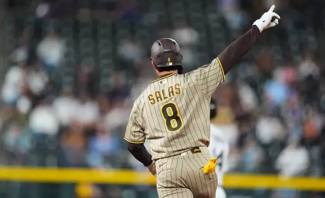 San Diego Padres' Ethan Salas gestures to the bullpen as he circles the bases after hitting a two-run home run off Colorado Rockies relief pitcher Nick Frasso in the fifth inning of a baseball game Wednesday, Sept. 16, 2026, in Denver. (AP Photo/David Zalubowski)wld