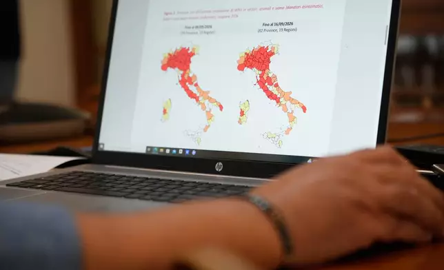 Antonino Bella, senior researcher at the Infectious Diseases Department of the Italian National Institute of Health, checks a map of Italy showing provinces with confirmed circulation of West Nile virus (WNV) in vectors, animals, and humans for the 2026 season, in Rome, Friday, Sept. 18, 2026. (AP Photo/Gregorio Borgia)