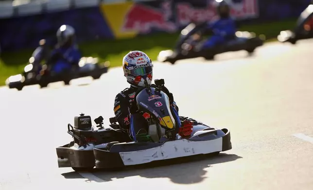 Red Bull's F1 driver Max Verstappen (3) races against the field during the Max v 100 go-karting event at Silverstone, Wednesday, Sept. 16, 2026, in Towcester, England. (Bradley Collyer/PA via AP)