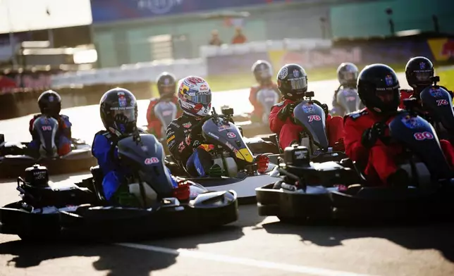 Red Bull's F1 driver Max Verstappen (3), center, races against the field during the Max v 100 go-karting event at Silverstone, Wednesday, Sept. 16, 2026, in Towcester, England. (Bradley Collyer/PA via AP)