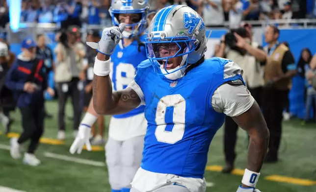 Detroit Lions' Jahmyr Gibbs reacts to his touchdown run during the second half of an NFL football game against the New York Jets in Detroit, Sunday, Sept. 27, 2026. (AP Photo/Paul Sancya)