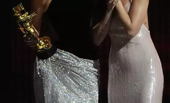 Dakota Johnson, right, with Taylor Swift, the recipient of the MTV VMA Artist Director Honors during the MTV Video Music Awards on Sunday, Sept. 27, 2026, at the Peacock Theater in Los Angeles. (AP Photo/Chris Pizzello)