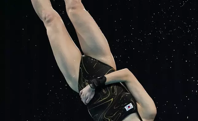 South Korea's Kim Na-hyun competes in the women's 10m platform preliminaries at the Asian Games in Tokyo, Japan, Tuesday, Sept. 29, 2026. (AP Photo/Hiro Komae)
