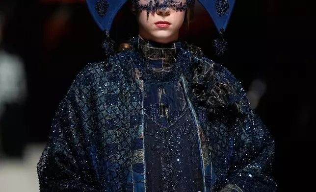 A model wears a creation by "Slava Zaitsev" at Moscow Fashion Week in Moscow, Saturday, Sept. 26, 2026. (AP Photo/Alexander Zemlianichenko)