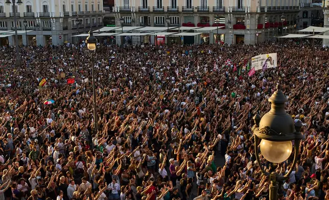 People gather during a protest following the eviction last Wednesday of 87-year-old Maricarmen to demand stronger laws to protect renters at Puerta del Sol in Madrid, Spain, Saturday, Sept. 26, 2026. (AP Photo/Manu Fernandez)